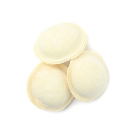 Photo of Frozen raw dumplings on white background, top view