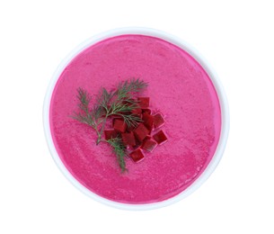 Delicious beetroot cream soup in bowl isolated on white, top view