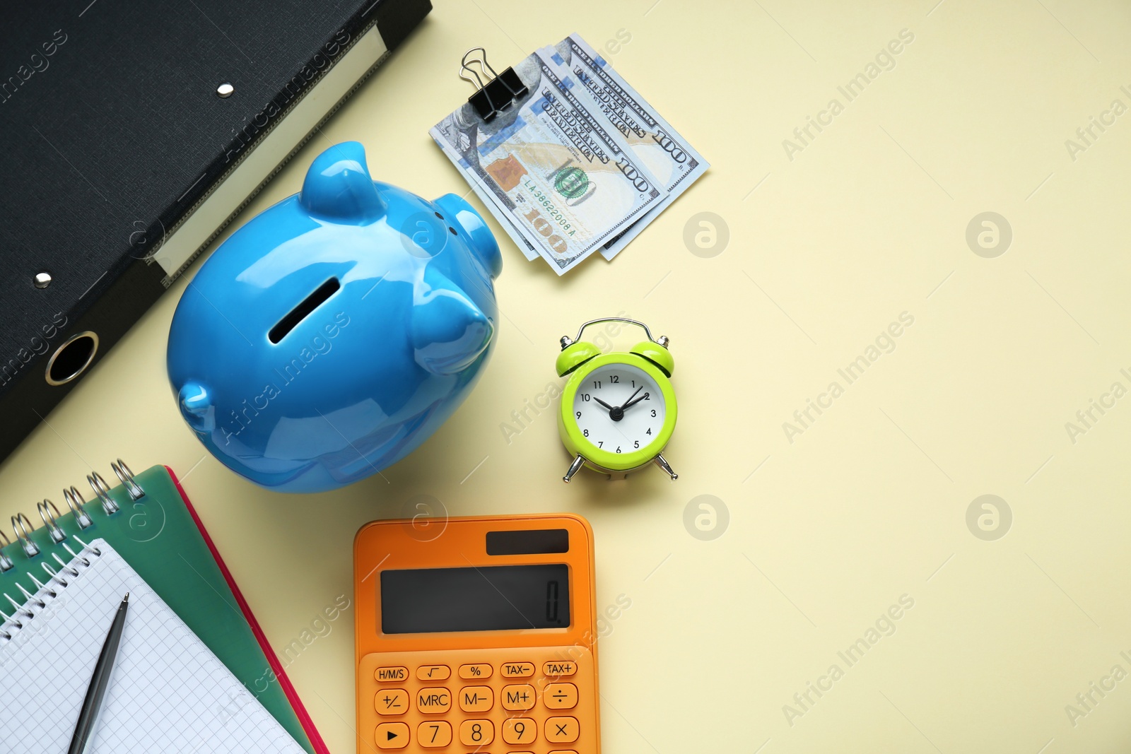 Photo of Flat lay composition with piggy bank and banknotes on beige background. Space for text