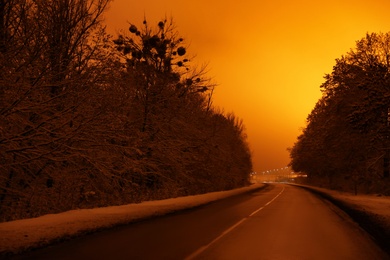 Photo of Beautiful view of twilight over country road. Winter landscape