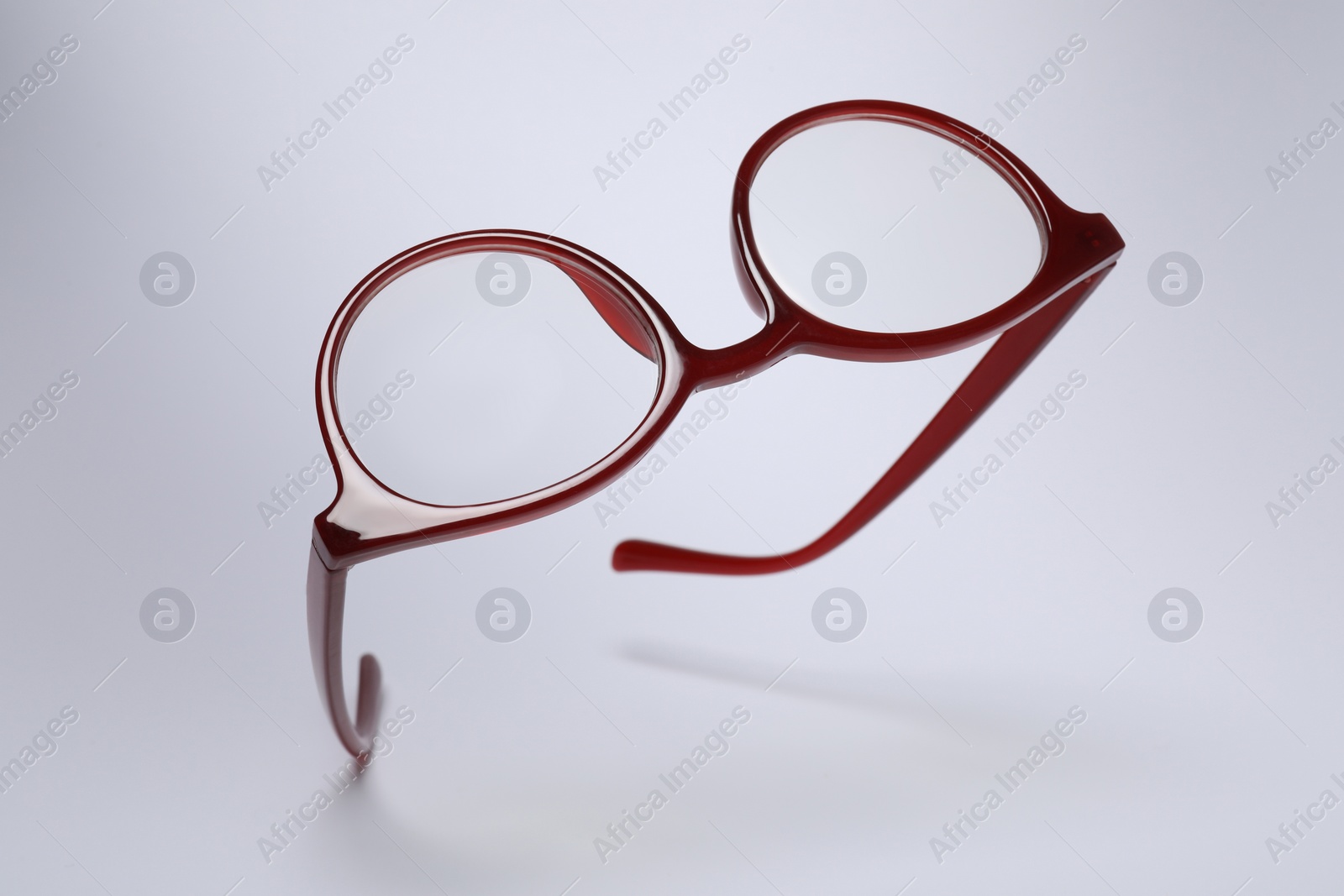 Photo of Stylish pair of glasses on light grey background