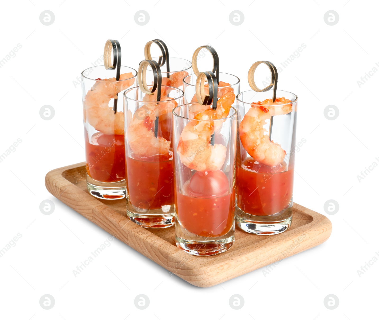 Photo of Tasty canapes with shrimps, tomatoes and sauce in shot glasses isolated on white