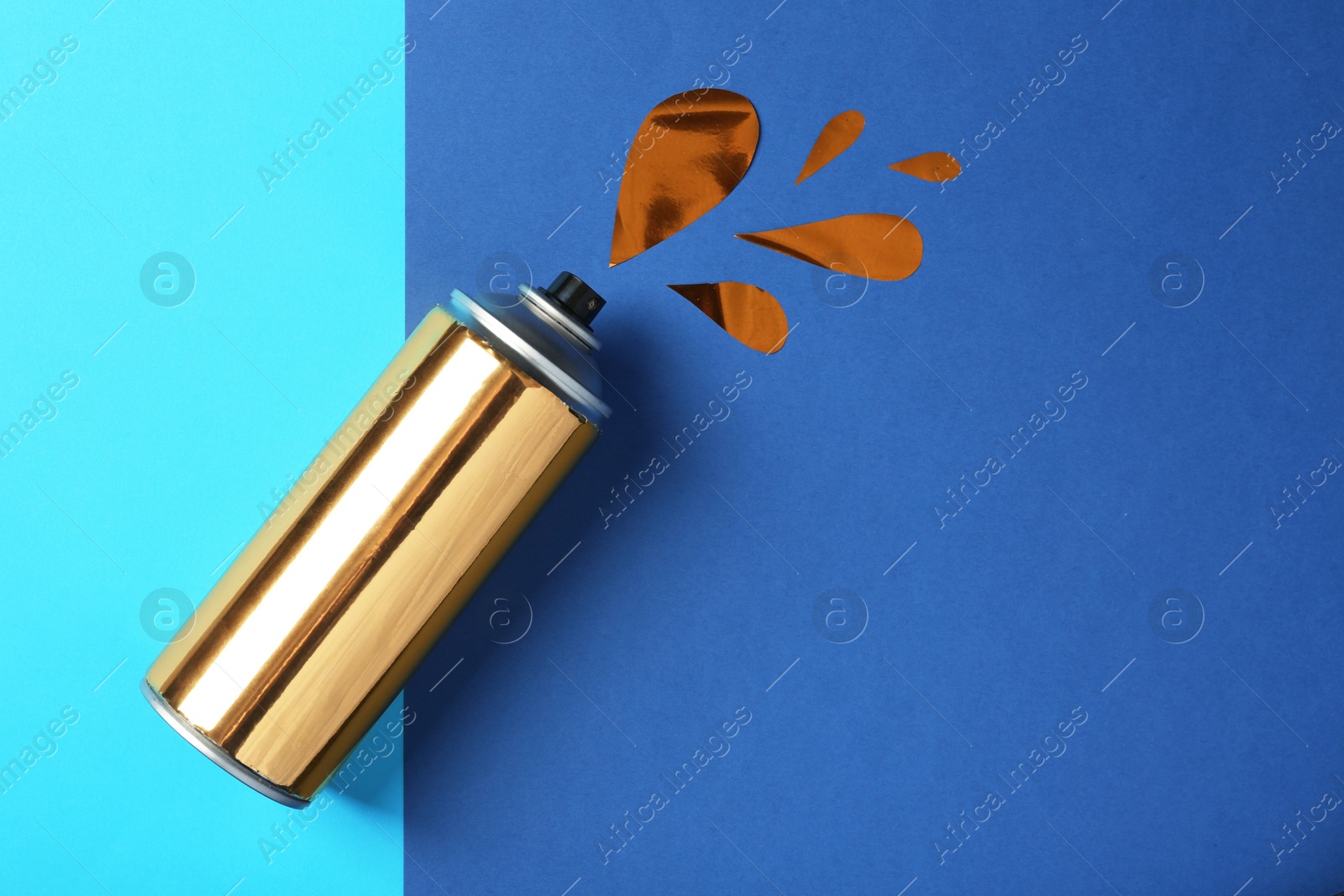 Photo of Flat lay composition with can of spray paint on color background. Space for text