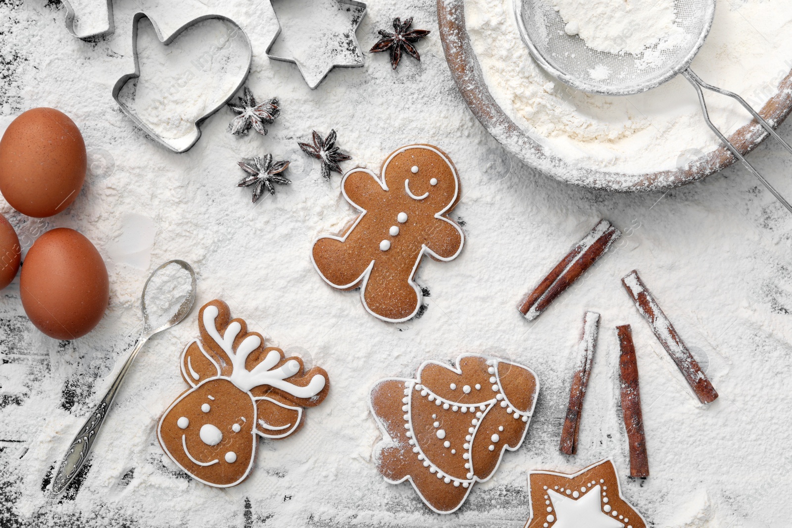 Photo of Flat lay composition with delicious homemade Christmas cookies and flour on table