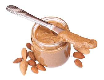 Photo of Tasty nut paste in jar, knife and almonds isolated on white