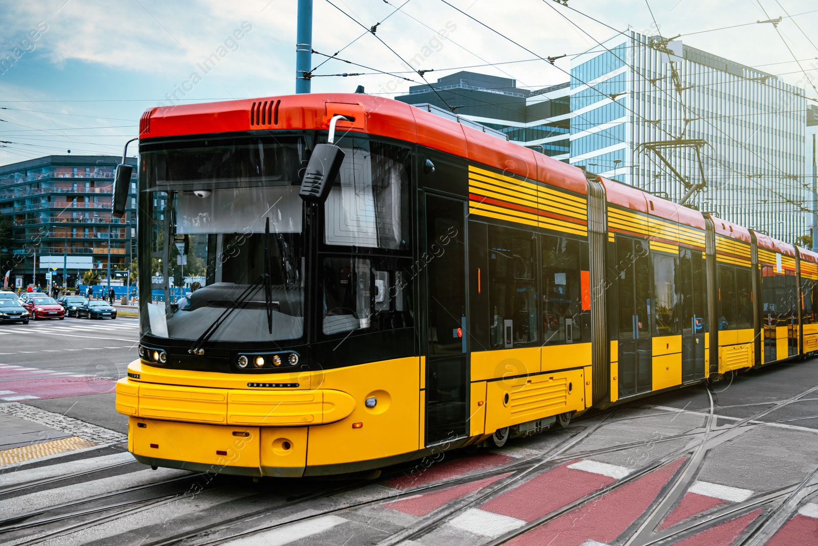 Photo of Modern tram on city street. Public transport