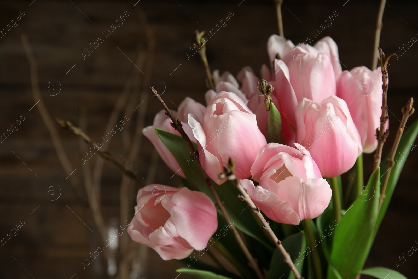 Photo of Beautiful bouquet of spring pink tulips on blurred background