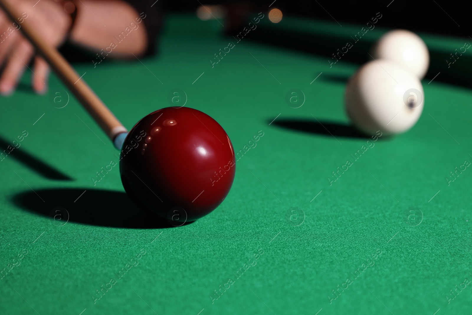 Photo of Young man playing billiard, closeup. Space for text