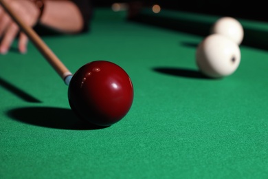 Photo of Young man playing billiard, closeup. Space for text