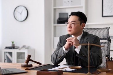 Photo of Notary working at wooden table in office, space for text