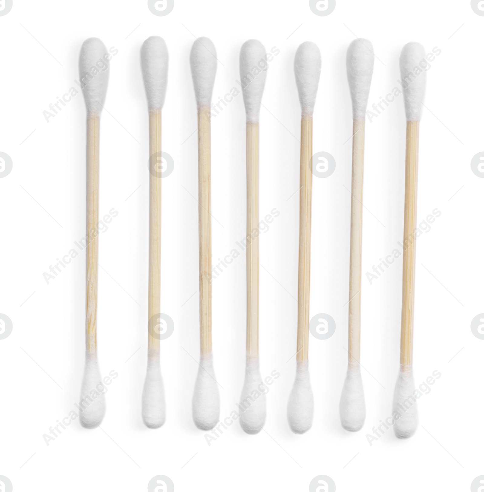 Photo of Wooden cotton buds on white background, top view