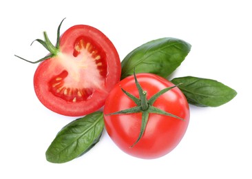 Photo of Fresh green basil leaves with cut and whole tomatoes on white background, top view