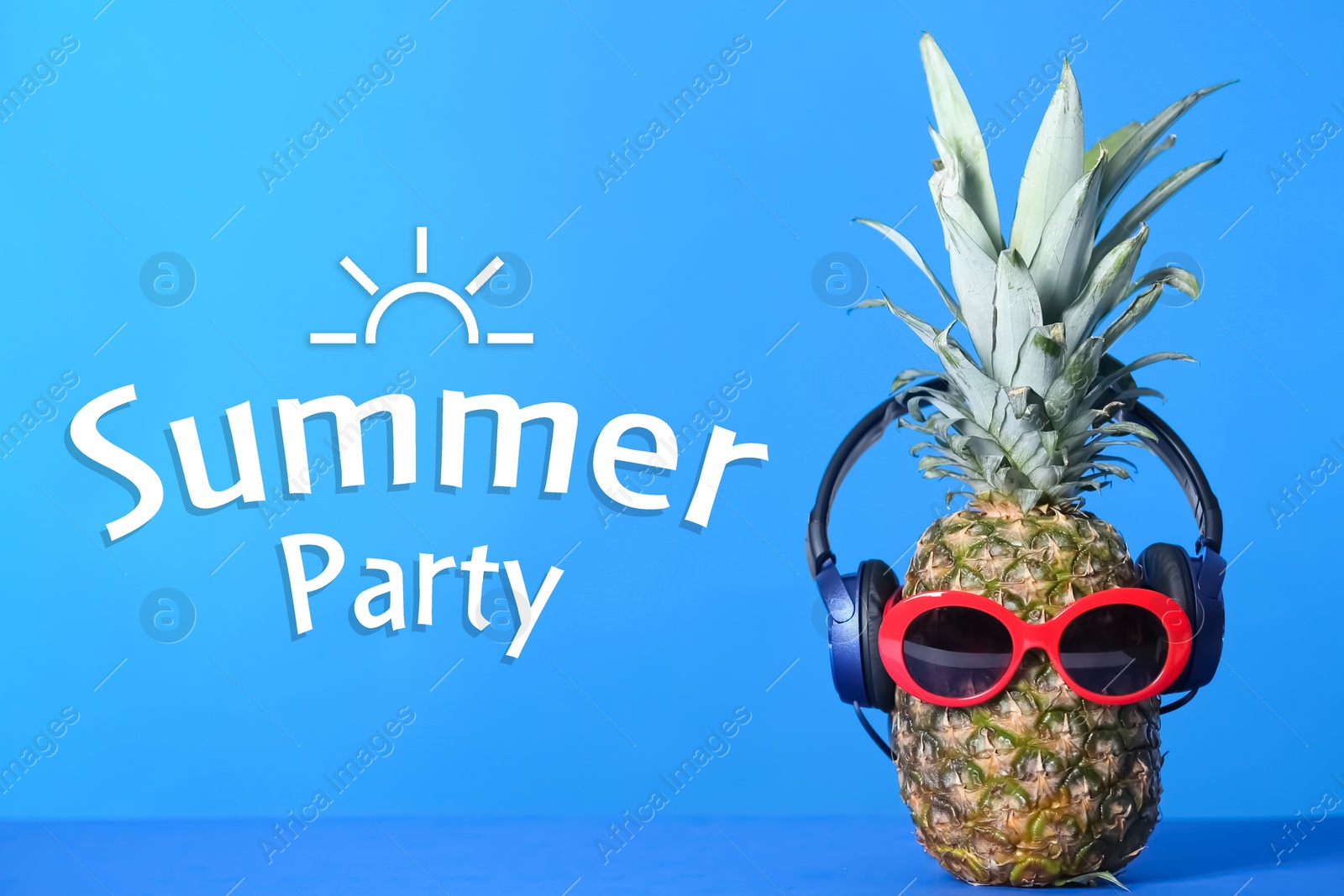 Image of Summer party. Pineapple with headphones and sunglasses on blue background 