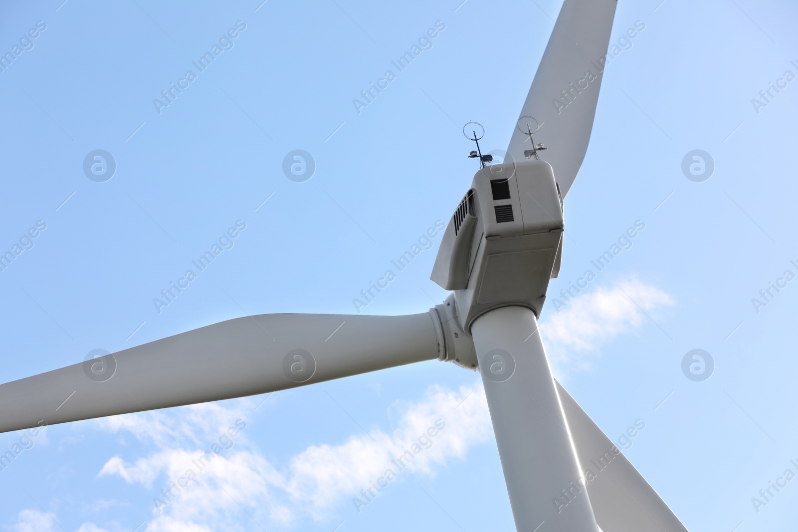 Photo of Wind turbine against beautiful sky, closeup. Alternative energy source