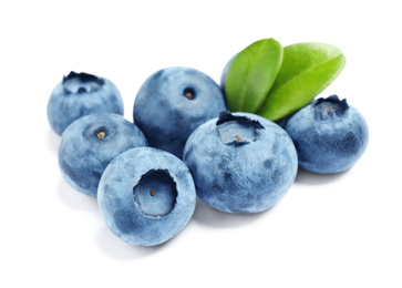 Fresh ripe blueberries with leaves on white background