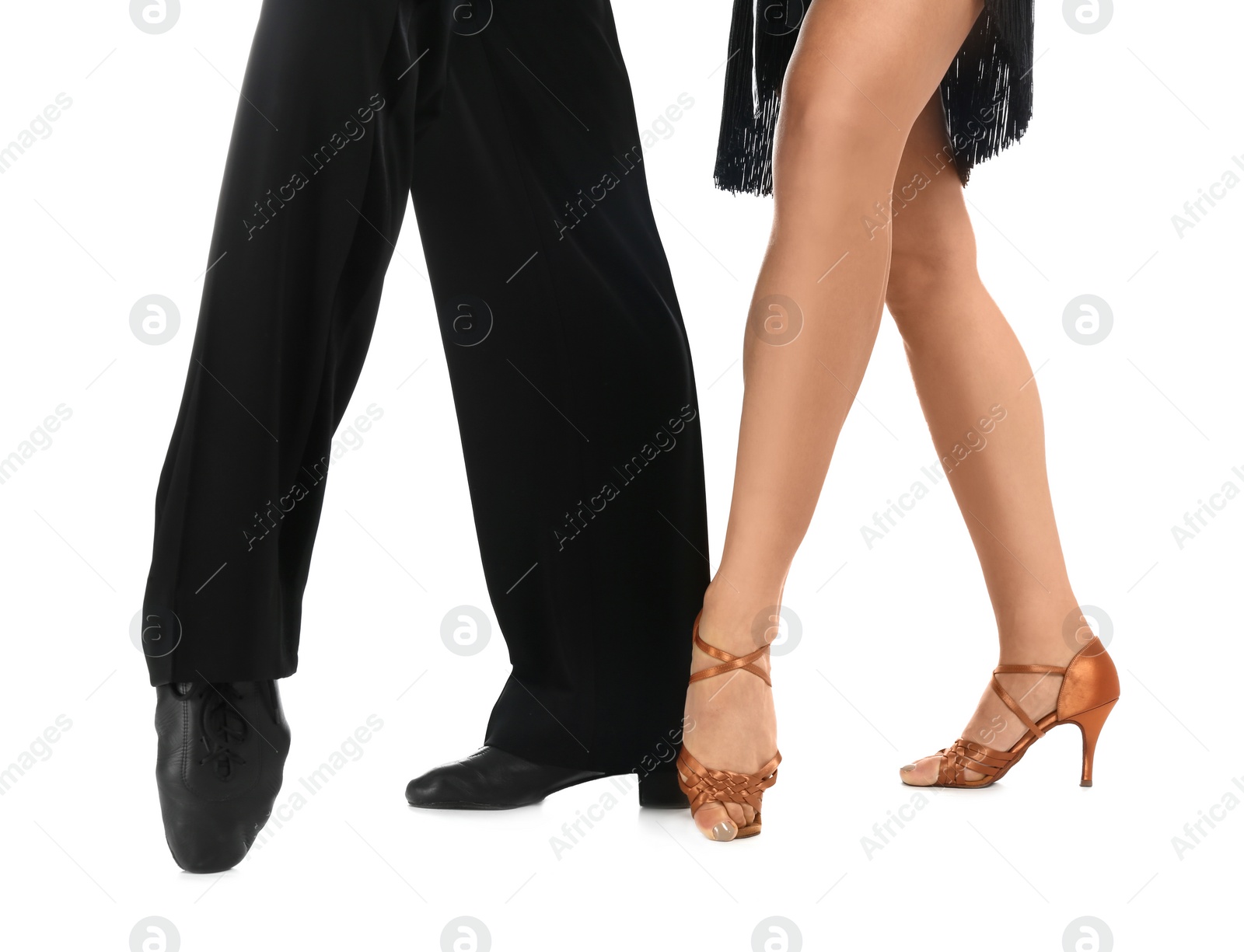 Photo of Young couple dancing on white background, closeup of legs