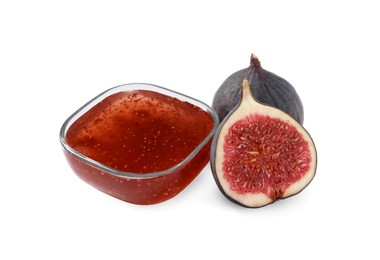 Photo of Glass bowl with tasty sweet jam and fresh figs isolated on white