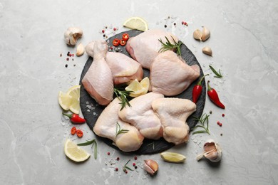 Photo of Flat lay composition with fresh raw chicken meat on light grey table