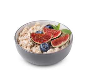 Bowl of oatmeal with blueberries, mint and fig pieces isolated on white