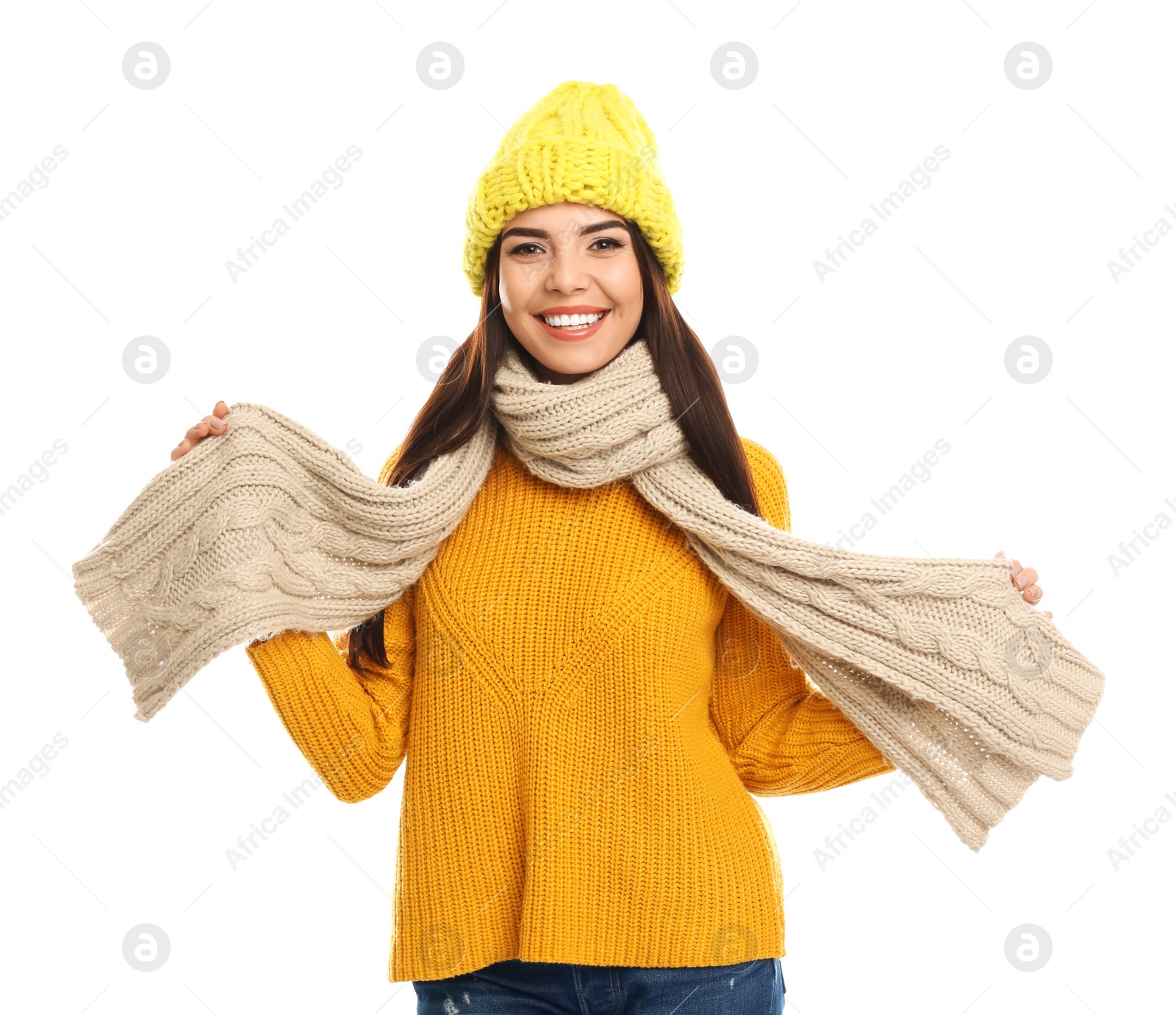 Photo of Happy young woman in warm clothes on white background. Winter vacation