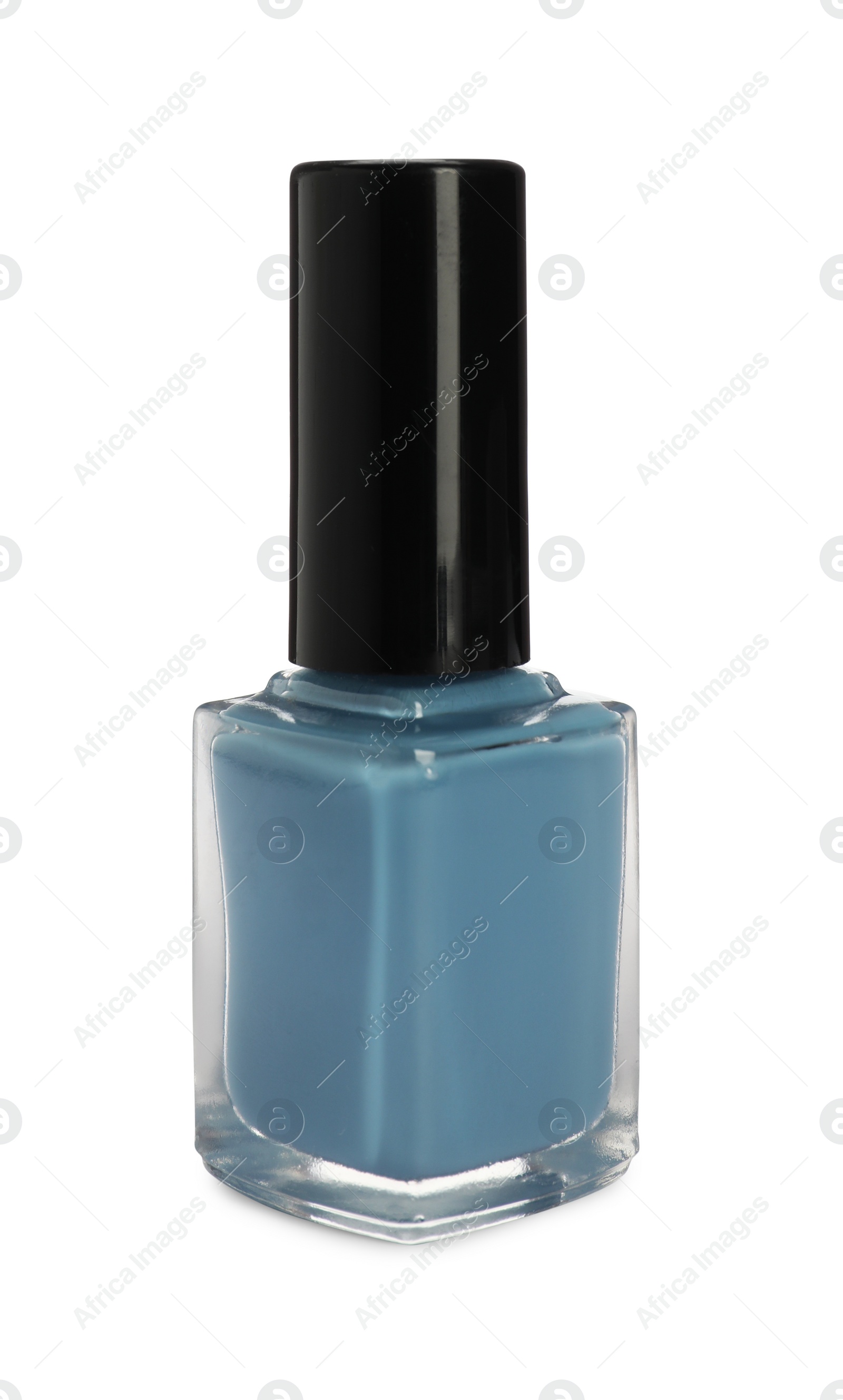 Photo of Light blue nail polish in bottle isolated on white