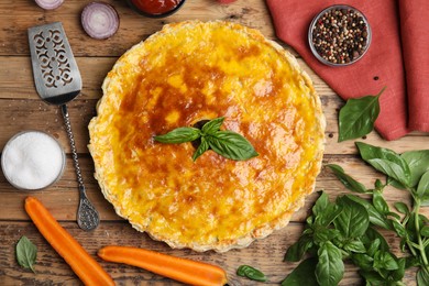 Photo of Delicious pie with minced meat on wooden table, flat lay