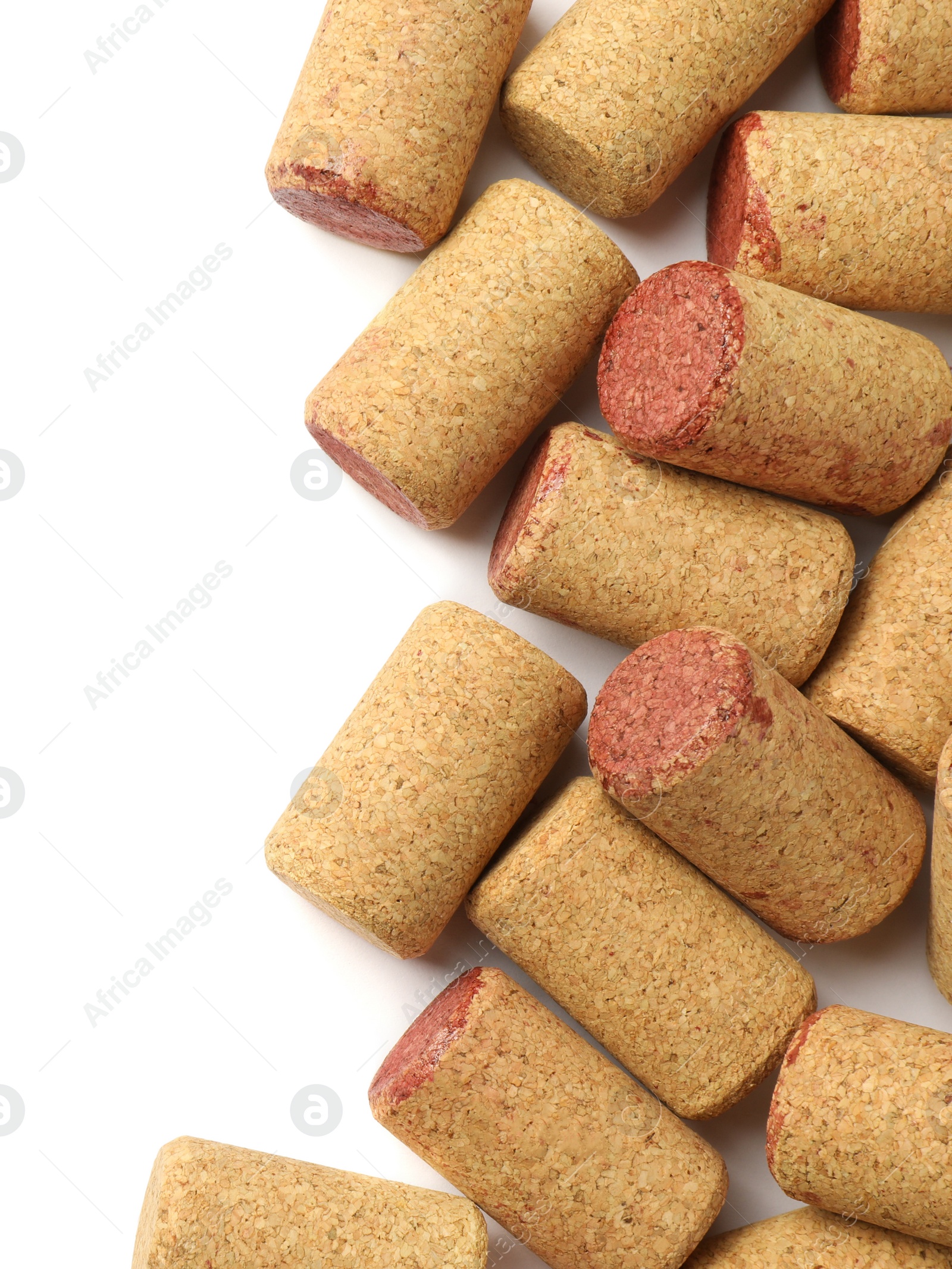 Photo of Wine bottle corks on white background, top view