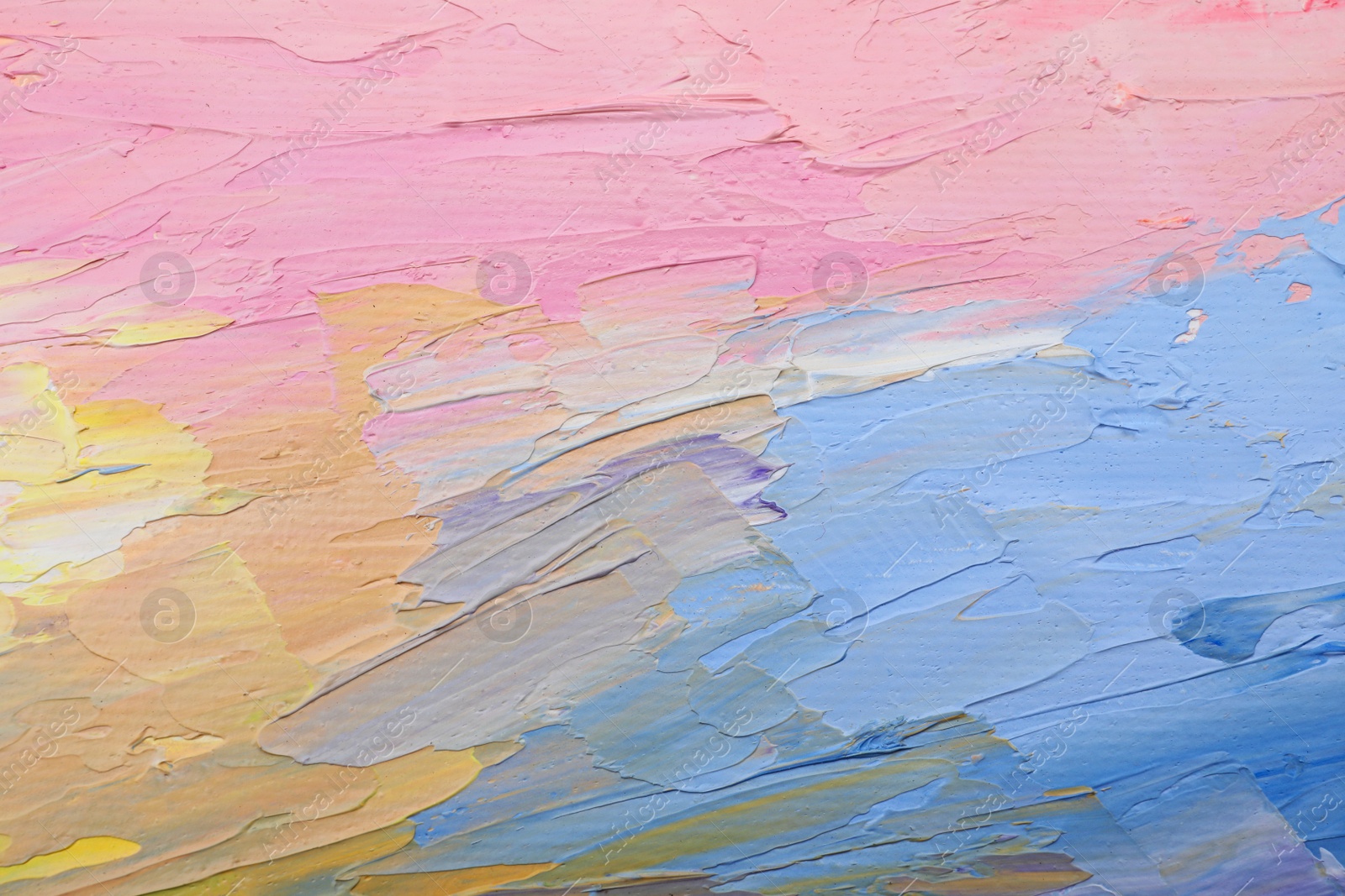 Photo of Beautiful strokes of pastel oil paints as background, closeup