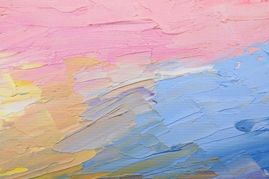 Photo of Beautiful strokes of pastel oil paints as background, closeup