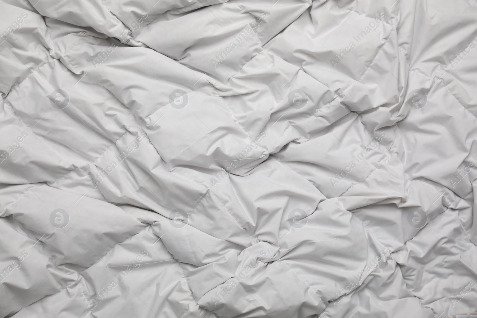 Photo of Soft crumpled blanket as background, top view