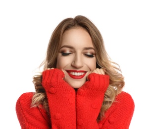 Photo of Happy young woman wearing red warm sweater on white background. Christmas celebration