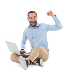 Photo of Emotional young man with laptop celebrating victory on white background