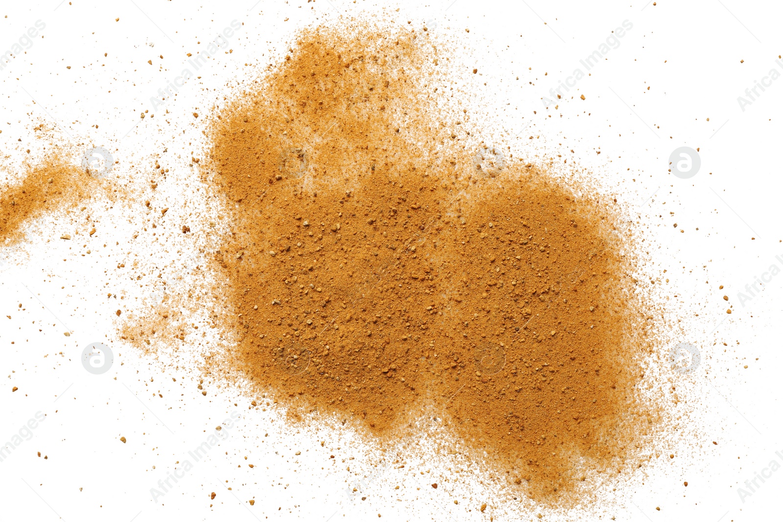 Photo of Pile of brown dust scattered on white background