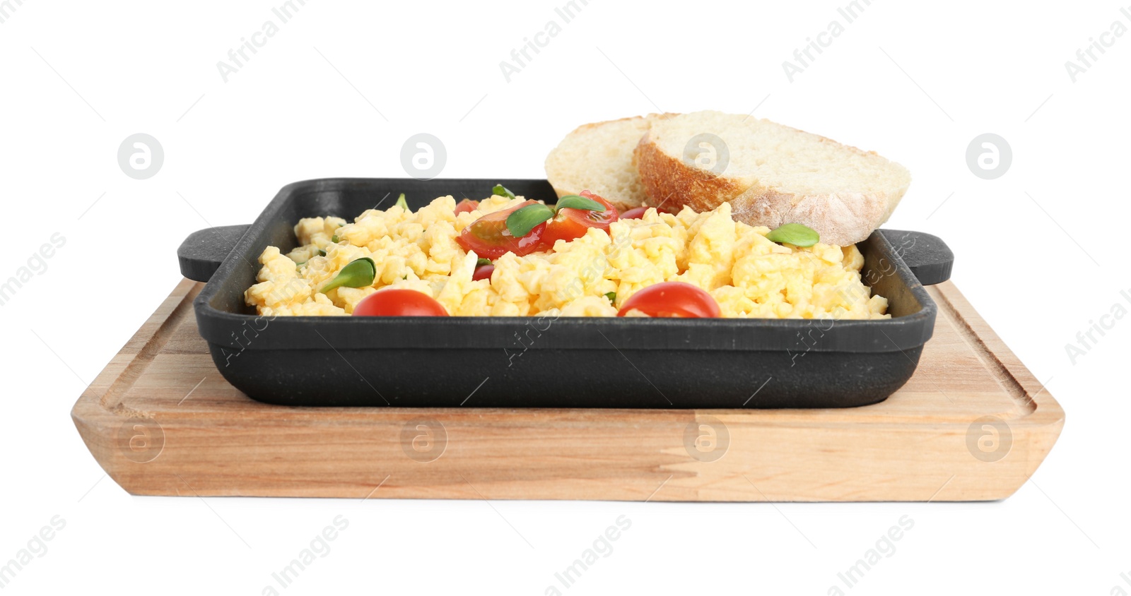 Photo of Tasty scrambled eggs with sprouts, cherry tomato and bread in frying pan isolated on white