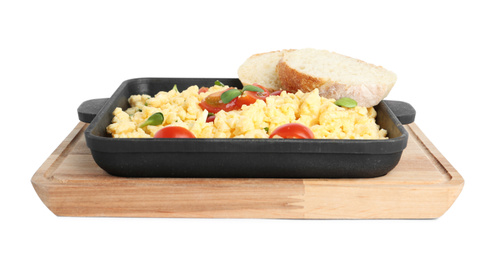 Photo of Tasty scrambled eggs with sprouts, cherry tomato and bread in frying pan isolated on white