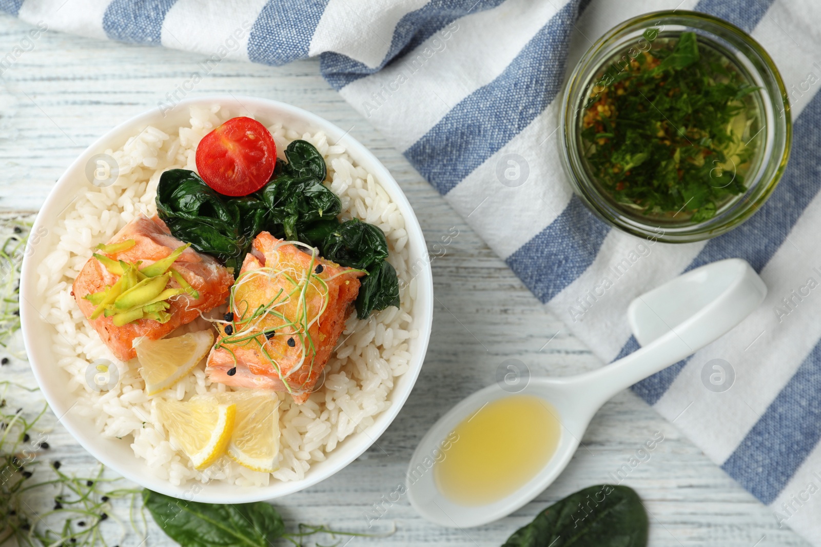 Photo of Tasty salmon with rice and spinach on white wooden table, flat lay