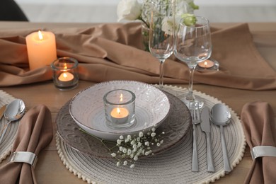 Photo of Festive table setting with beautiful floral decor in restaurant