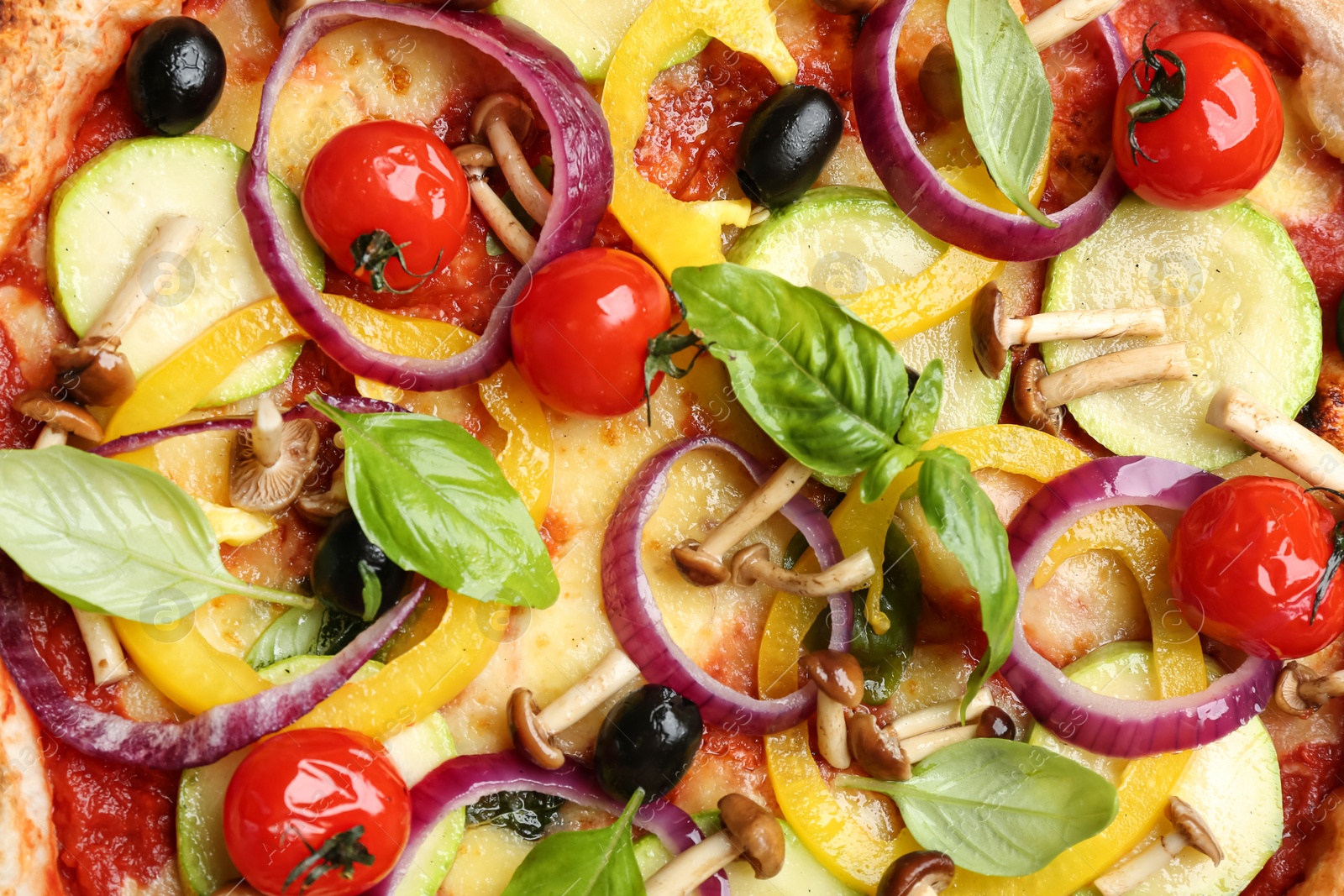 Photo of Delicious hot vegetable pizza with mushrooms as background, closeup