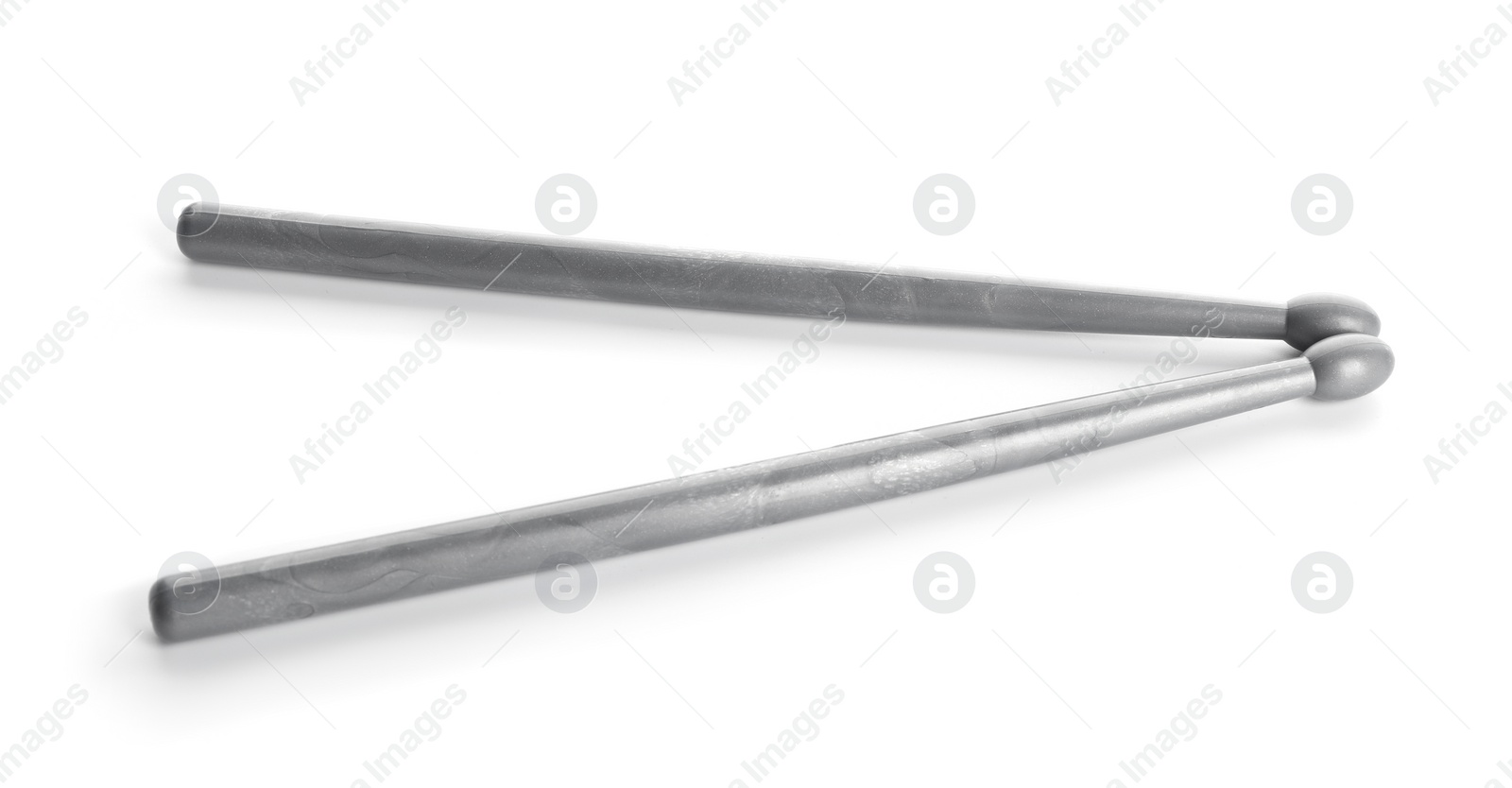 Photo of Two grey drum sticks isolated on white