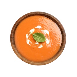 Photo of Tasty creamy pumpkin soup with basil in bowl on white background, top view