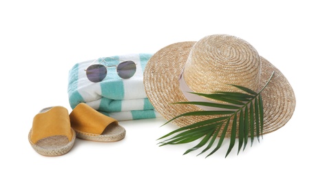 Different stylish beach accessories on white background