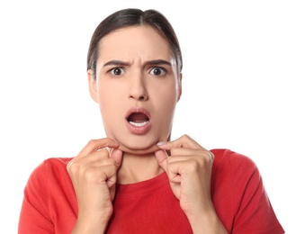 Emotional young woman with double chin on white background