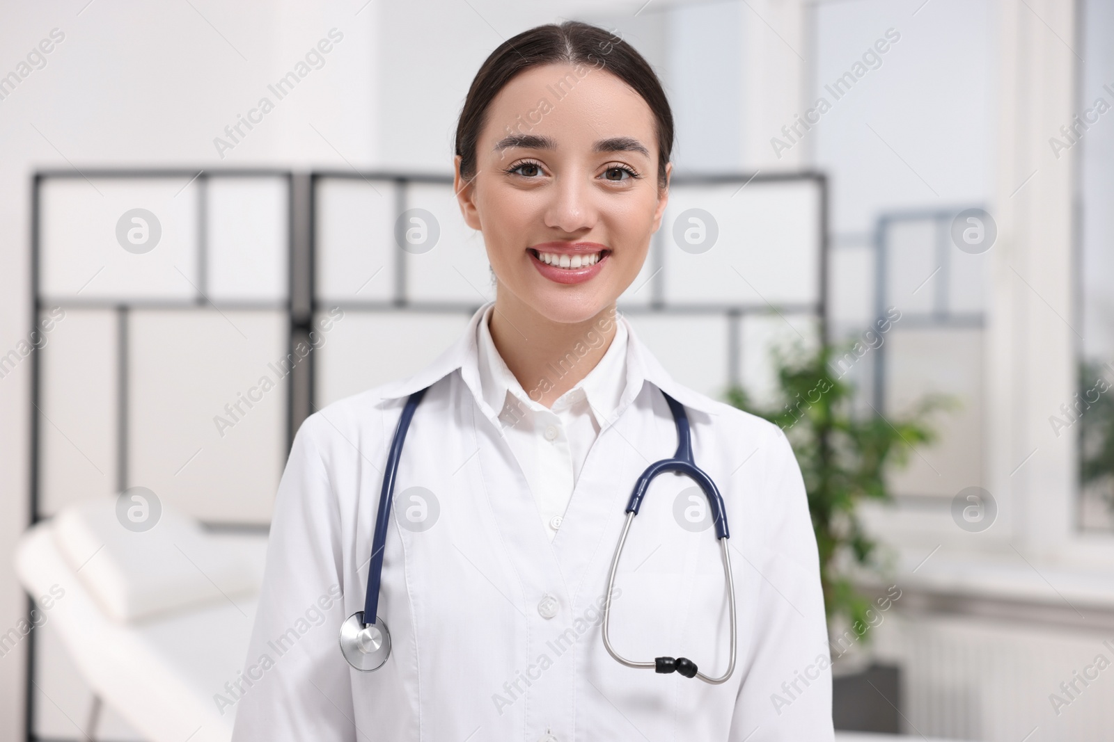 Photo of Portrait of medical consultant with stethoscope in clinic