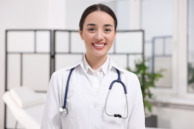 Portrait of medical consultant with stethoscope in clinic