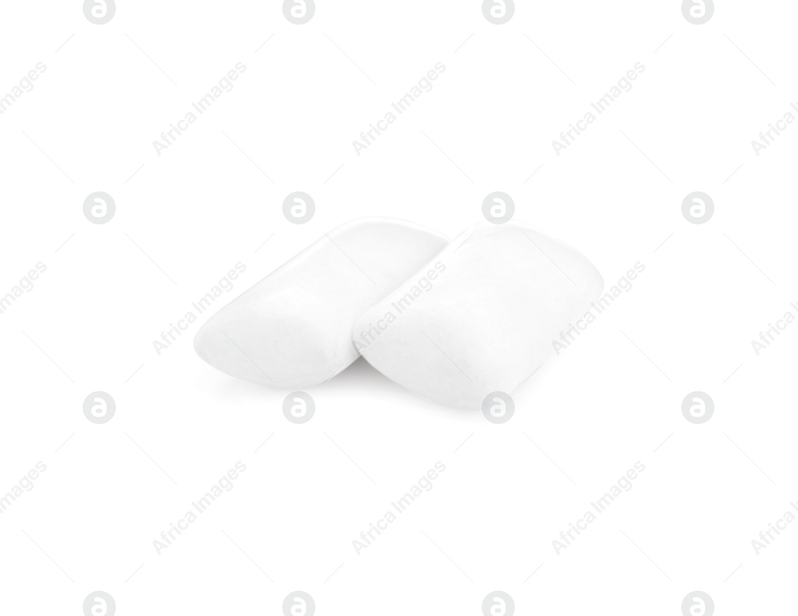 Photo of Two pieces of chewing gum on white background