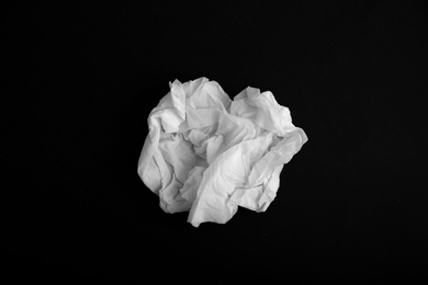 Photo of Used paper tissue on black background, top view