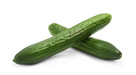 Photo of Two long fresh cucumbers isolated on white