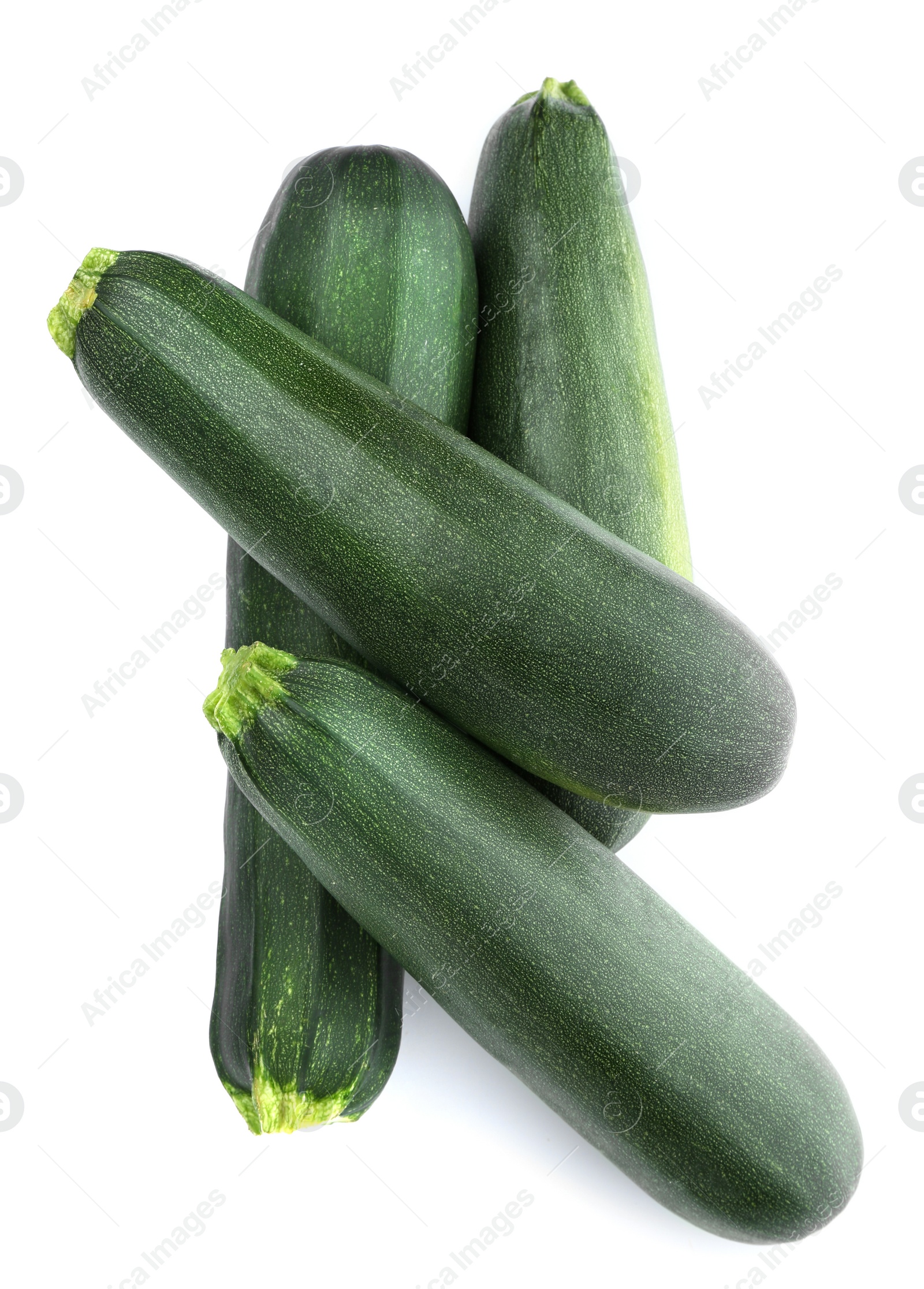 Photo of Fresh ripe green zucchinis on white background, top view