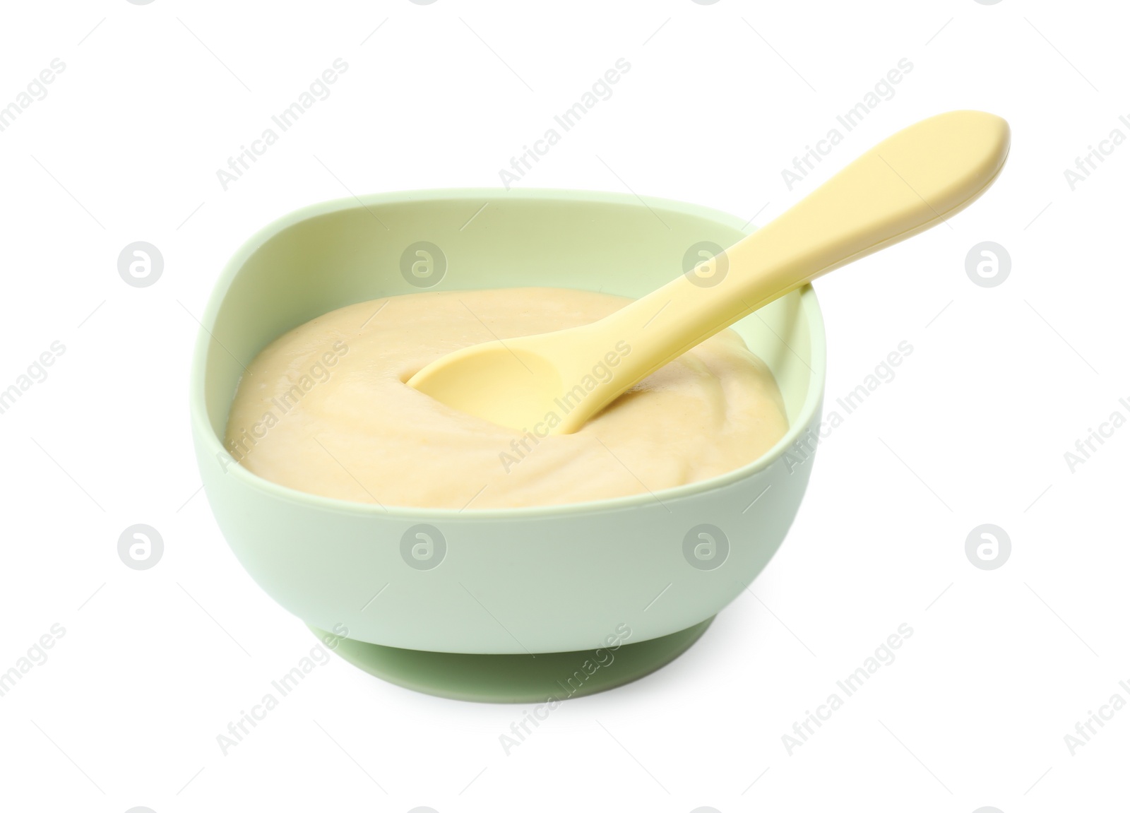 Photo of Tasty baby food and spoon in bowl isolated on white