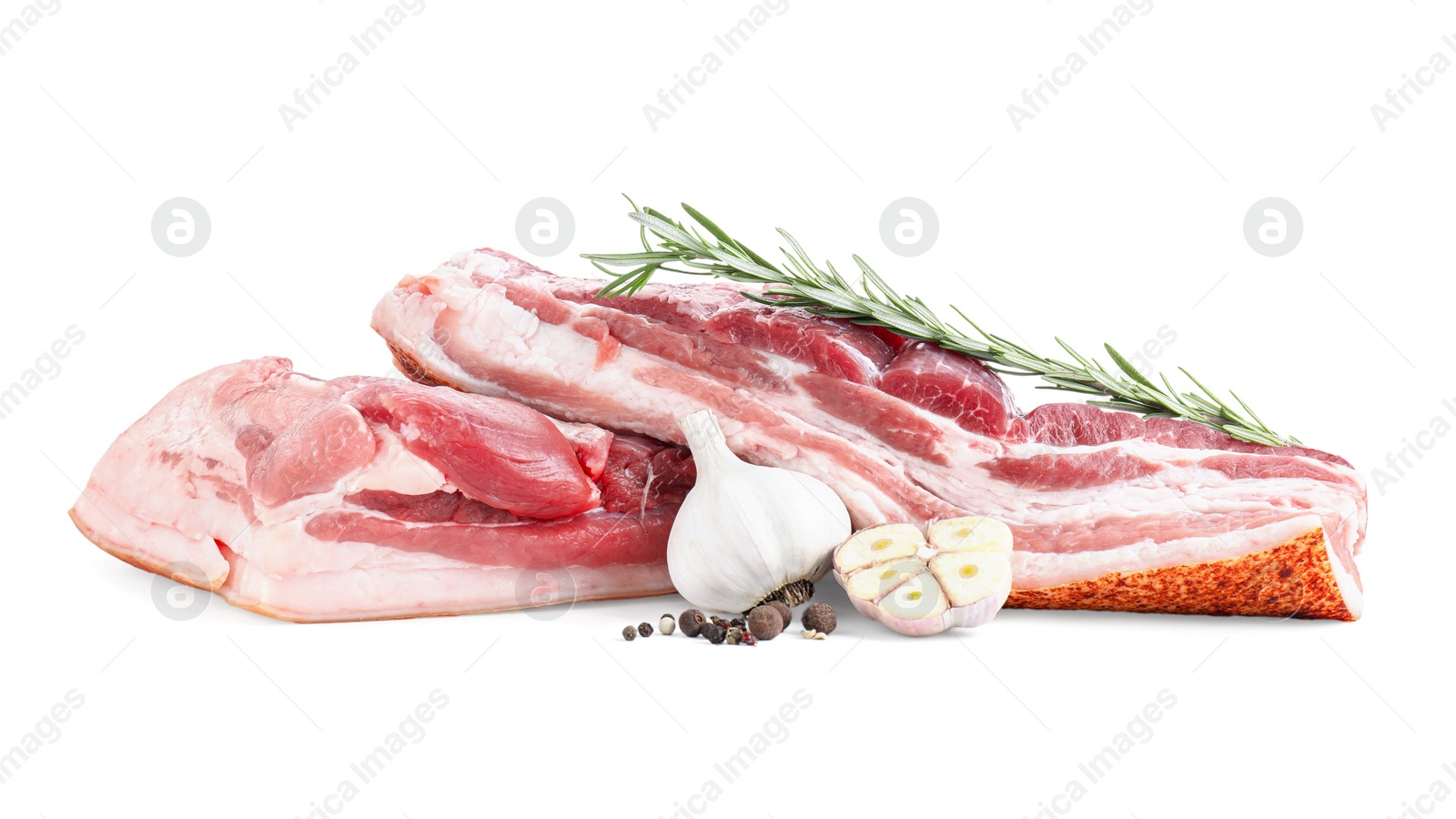 Photo of Pieces of raw pork belly, garlic, rosemary and peppercorns isolated on white